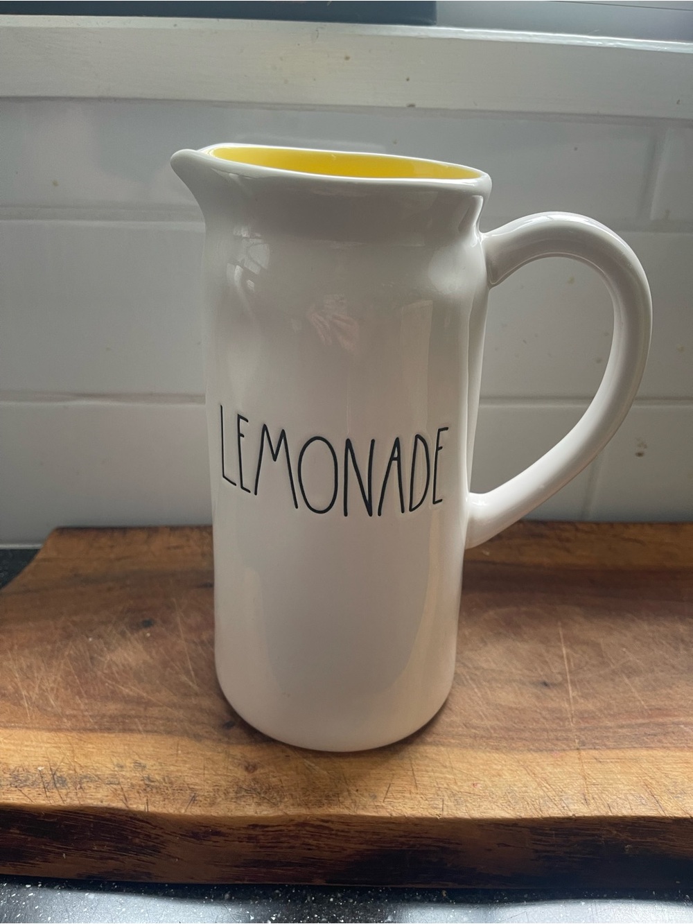 Rae Dunn White Ceramic Pitcher with Yellow Interior